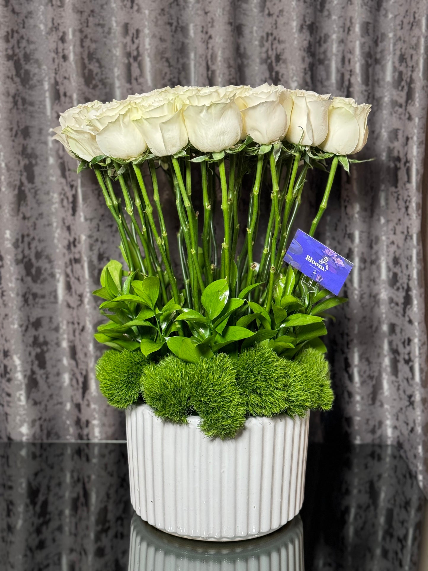 White vase with roses